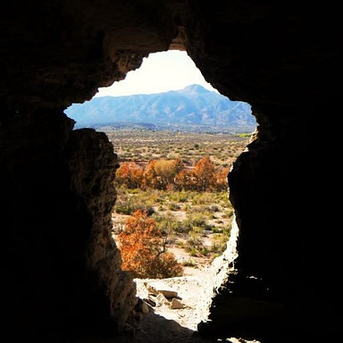 This opening looks over the Verde Valley. It's carved out of the wall, serving as a door to the cave, and it's kind of curvy.