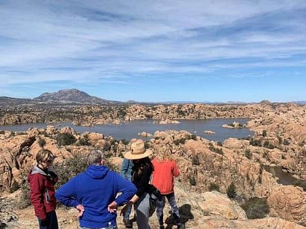 Several hikers overlook Watson Lake.