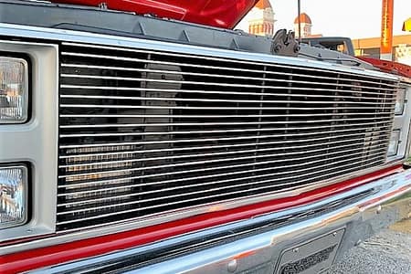 The grill of a red truck