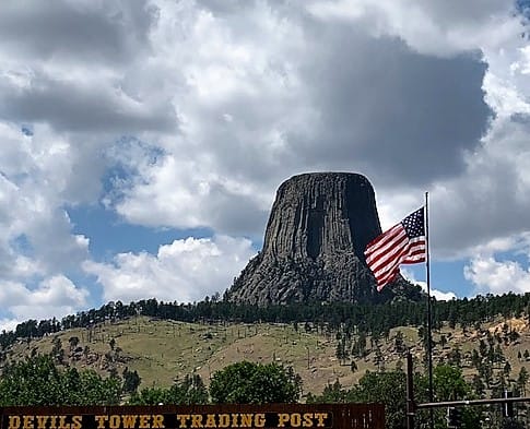 Devils Tower behind the American Flag
