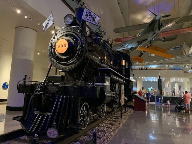 Visit the fascinating Museum of Science and Industry. here is a black locomotive train on display at the museum.