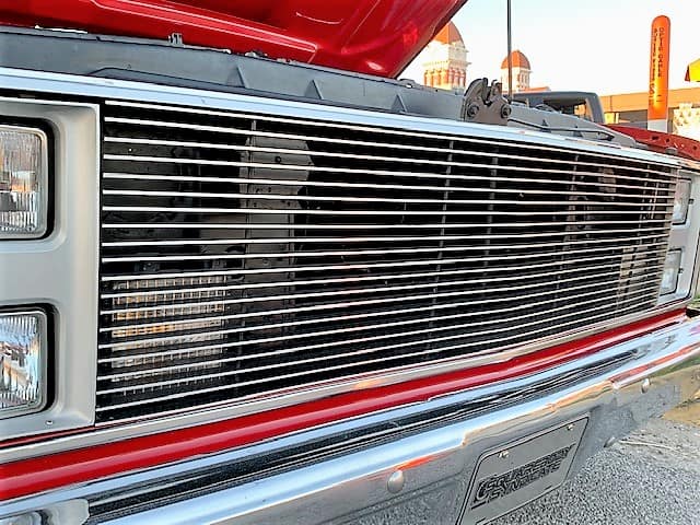 The grill of a red truck