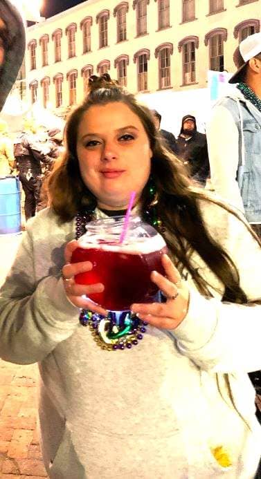 A woman with a drink in a fish bowl!