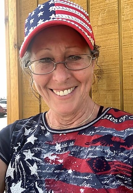 This is a picture of me wearing a red white and blue ball-cap, with bling! And a patriotic t-shirt. Taken on the 4th of July 2021. More than mount rushmore, this is sturgis south dakota!
